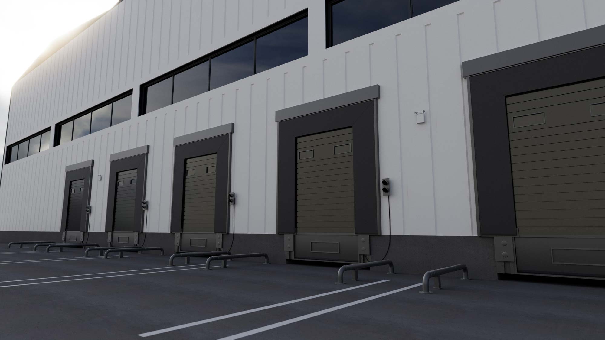 An Evenlite Evolve Emergency Light installed outside of a warehouse during the day.