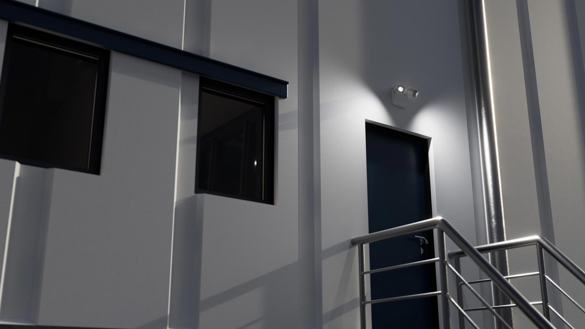 Evenlite Evolve Remote Lamp Heads installed outside of a warehouse at night.