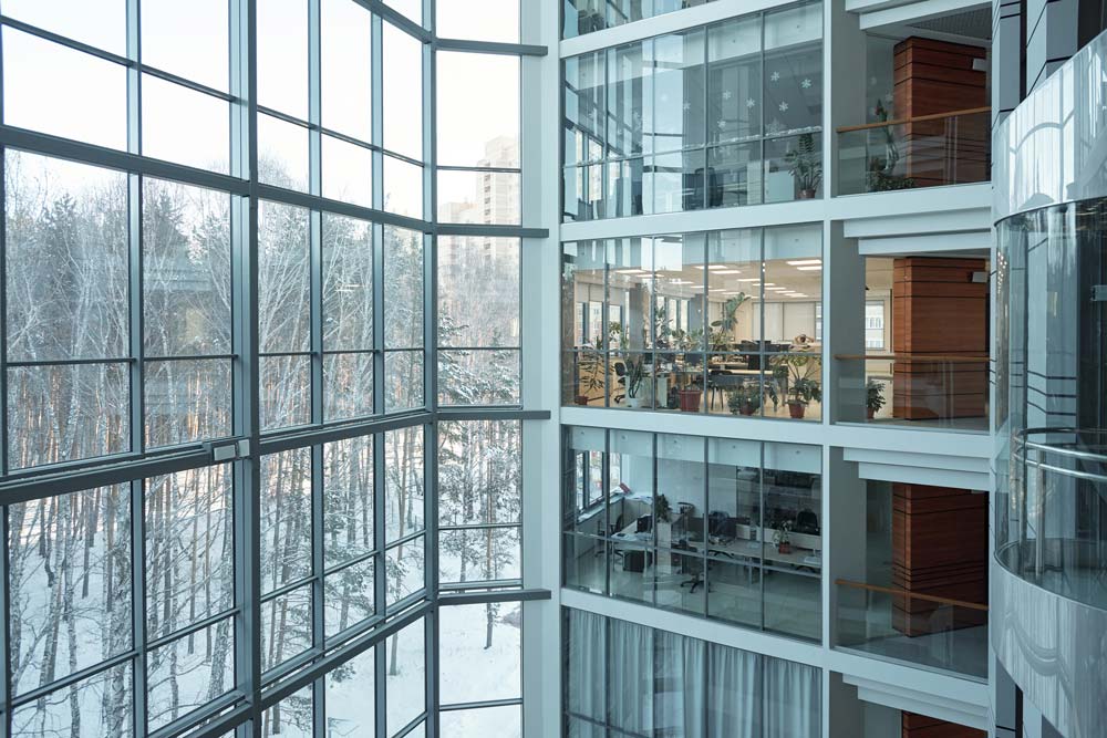 Industry-Leading Efficiency A photo of a multi-level office space inside of a glass building